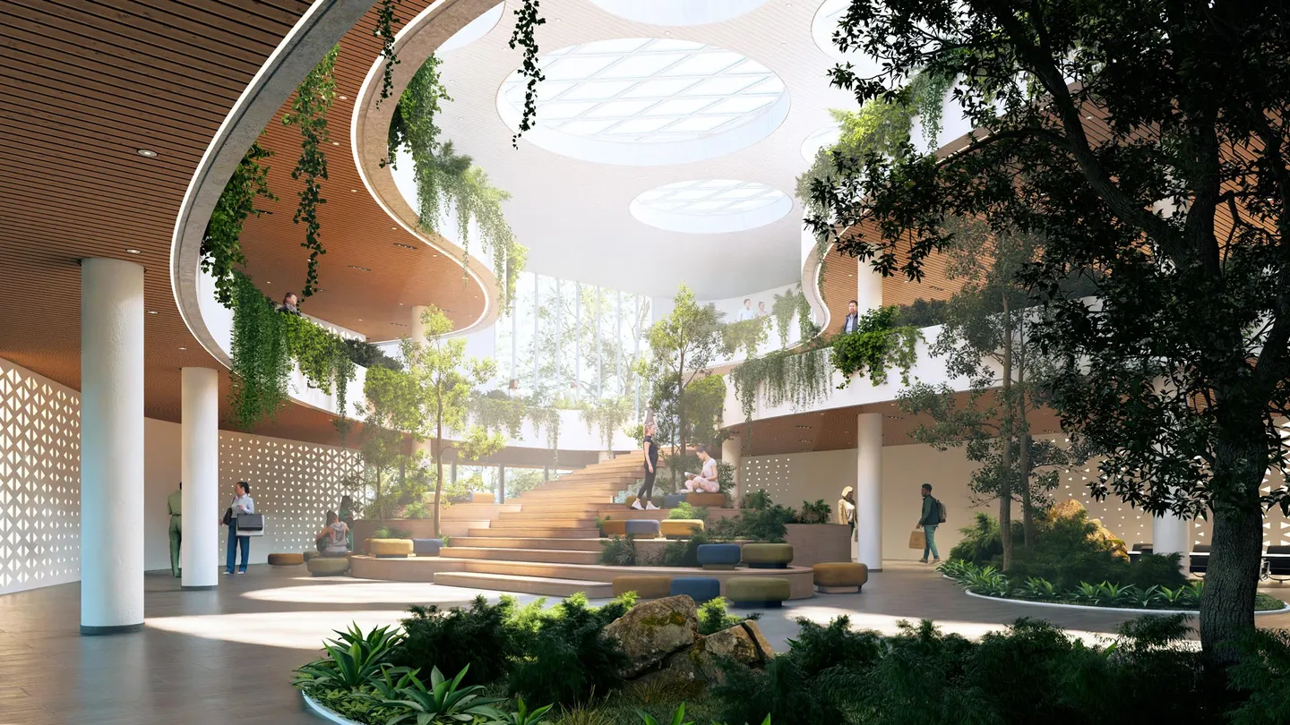 Innenraum eines geschwungenen Gebäudes mit Sonnenlicht und Nebeleffekt